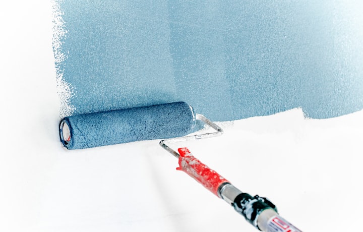 Fresh coat of paint rolling onto a wall